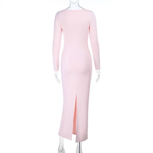 Detail view of pink long sleeve maxi dress featuring a high-slit back hem and slim fit