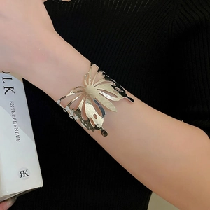 Elegant hollow butterfly open cuff bracelet in silver finish with metallic hollow design