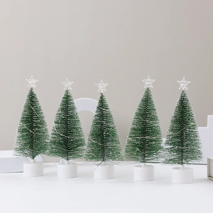 Set of five mini LED Christmas trees with white bases and star toppers on grey background