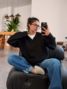 Women's vintage oversized black V-neck knit sweater in a loose casual streetwear style