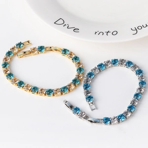 Close-up of 6MM round cubic zirconia tennis bracelets with gold and silver settings