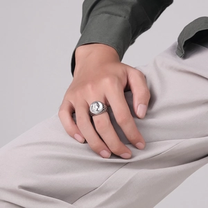 Vintage Roman Caesar coin ring in stainless steel worn with professional attire