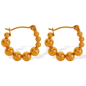 Golden beaded hoop earrings with gradient spherical pearls in a minimalist geometric style