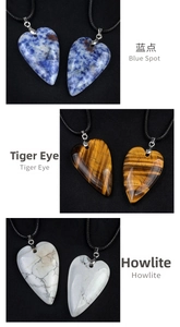 Detailed comparison of heart-shaped pendants in Blue Spot, Tiger Eye, and Howlite stone