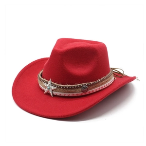 Detail of red wool felt cowboy hat with woven band and star-shaped turquoise ornament