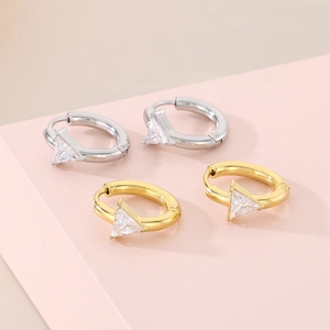 Detail of 18K plated stainless steel hoop earrings with triangle glass zircon pendants