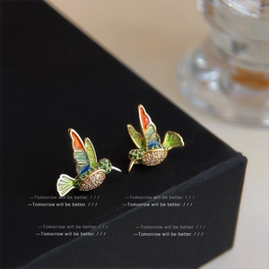 Vibrant enamel hummingbird earrings with colorful gradient wings and pavé zircon stones