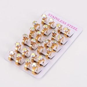 Macro view of 12 pairs of gold stainless steel hoop earrings with faceted iridescent stones