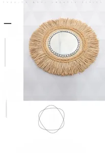 Detail of round raffia wall mirror with handmade silver bead inner trim and natural fringe