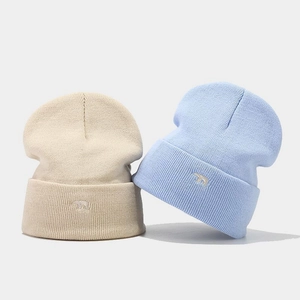 Thick warm knit beanie featuring a cute polar bear embroidery with a folded cuff design