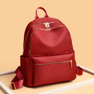 Waterproof red oxford cloth backpack for women with high-capacity and golden zippers
