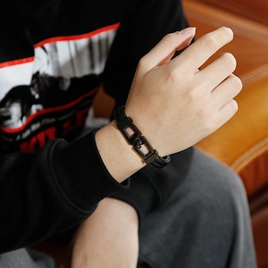 Men's minimalist black braided leather bracelet with a stylish titanium steel clasp