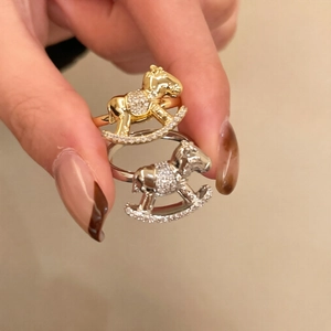 Sparkling zircon rocking horse rings in gold and silver finish for a trendy look