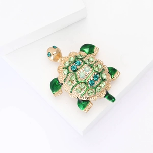 Exquisite turtle brooch with gold plating and green blue rhinestones on geometric stand