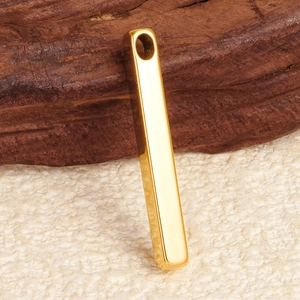 Detailed view of a 304 stainless steel gold rectangular pendant on wooden background