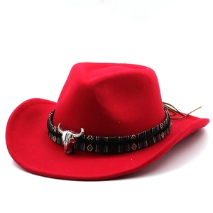 Red western cowboy hat with ethnic patterned band and silver bull head ornament