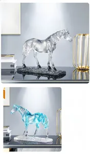 Close-up of modern resin horse statue with blue-green gradient and rock texture base