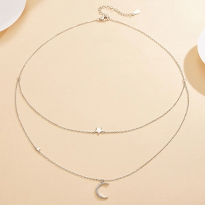 Close-up of S925 silver double-layer necklace with micro-pave zircon moon and star pendant
