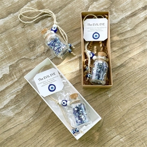 Handmade Evil Eye wishing bottle charm set with cork lid and protective card in a gift box