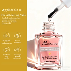 Macro detail of 12ml nail strengthener base oil liquid dripping from the brush tip