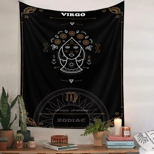 Detail of Virgo zodiac tapestry with gold lines on black background in cozy room setting