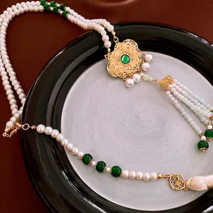Chinese pearl tassel necklace with gold hollow lock and green gemstone pendant