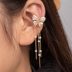 Elegant gold butterfly ear cuff with cubic zirconia, pearls and long chain tassels