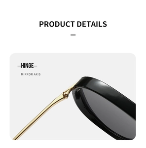 Detailed macro shot showing the premium gold metal hinge and sleek black frame assembly