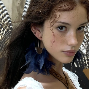 Ethnic style bohemian dark blue feather tassel earrings worn by model with lace top