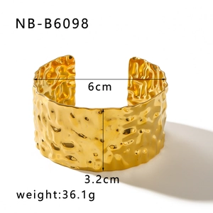 Chunky 18K gold-plated stainless steel cuff bracelet with hammered texture and wavy surface