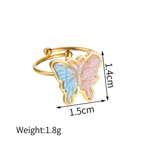 Detailed view of 18k gold butterfly ring with pink and blue wings, 1.8g weight