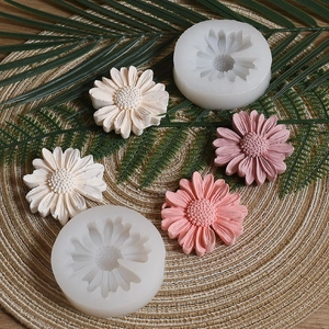 Detailed macro view of daisy flower silicone molds with finished colorful resin crafts