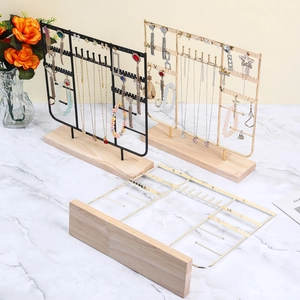 Iron jewelry display stand with wooden base for necklaces and earrings in black and gold