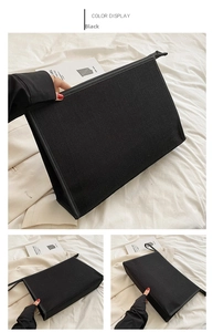 Détail de la pochette professionnelle en toile noire avec fermeture éclair supérieure