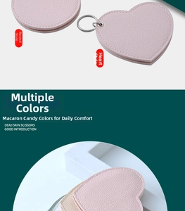 Detailed view of pink lychee textured PU leather heart and round portable mini mirrors