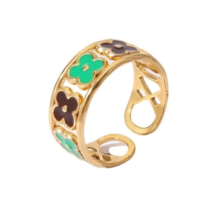 Detail of 18k gold plated open ring with green and brown enamel flower pattern