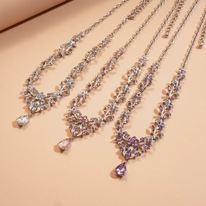 Three-piece set of elegant rhinestone flower necklaces with teardrop crystal pendants