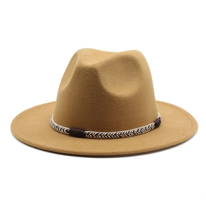 Detail of camel wool fedora hat with black and white woven rope band decoration