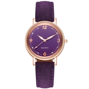 Detail of a purple quartz watch with rose gold case and sparkling rhinestone markers