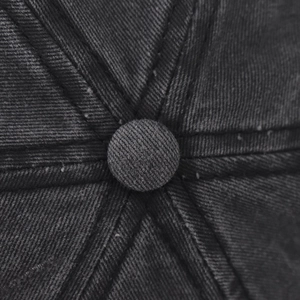 Macro detail of washed cotton baseball cap crown with stitched top button and vintage texture