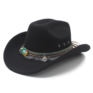 Black western cowboy hat with colorful braided band, fringe, and vintage coin pendant