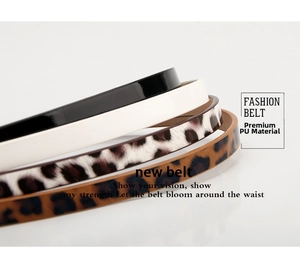 Detail showing four stylish skinny belts in black, white, and leopard print PU leather