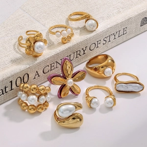 Nine-piece gold-plated titanium steel ring set with elegant pearls and floral designs