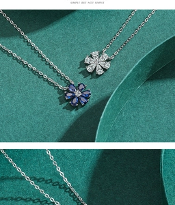 Detailed close-up of s925 silver necklaces with blue and clear zircon flower pendants
