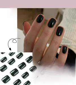 Detailed view of short square dark green press-on nails shown on model and in a grid