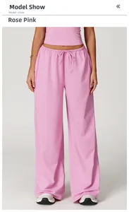 Detail of rose pink wide leg leisure pants showing elastic drawstring waist and fabric texture