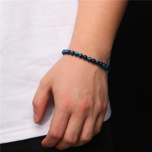 Blue tiger eye 6mm stone bead bracelet featuring natural chatoyancy on elastic cord