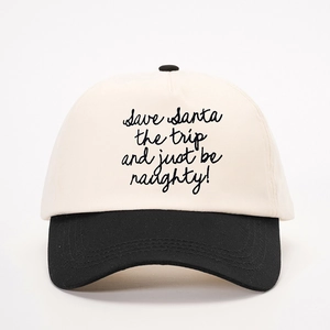 Close-up of Save Santa the trip slogan embroidery on two-tone canvas baseball cap