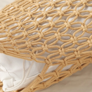 Detail view of woven cotton rope pattern with hollow mesh and white fabric lining