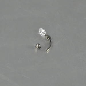 Detail showing G23 titanium curved bar and internally threaded silver zircon stud